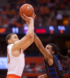 Brandon Triche attempts a shot over DePaul's Jamee Crockett. Triche finished his senior night with 15 points on 4-of 9-shooting.