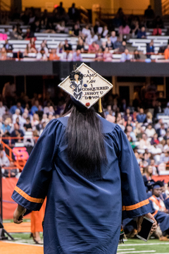 A student's cap featuring lyrics to Isaiah Rashad's 