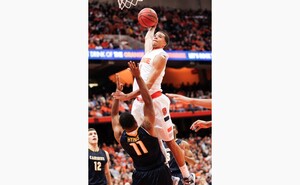 Syracuse guard Michael Carter-Williams attempts a one-handed slam in the Orange's 85-61 win over Canisius on Saturday in the Carrier Dome. 