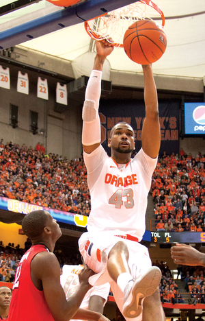 James Southerland dunks in the second half of SU's victory against St. John's. The Orange forward returned from his six-game suspension with a 13-point performance.