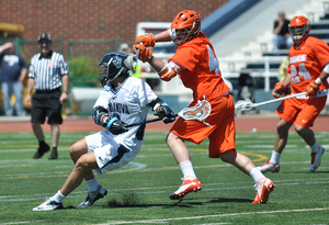 Syracuse's Matt Harris defends Villanova attack Jack Rice in the Orange's 13-9 win over the Wildcats in the Big East tournament championship game. The Orange's defense shut down Villanova's leading scorers. 