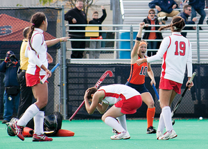 Lauren Brooks celebrates after scoring the game-winning goal in the Orange's 3-2 overtime win against Cornell on Sunday.