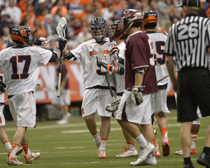 Nicky Galasso bumps fists with Dylan Donahue during Syracuse's blowout 19-6 win over Colgate on Saturday in the Carrier Dome.