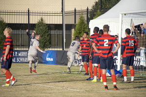 Georgetown players celebrate beating Syracuse in the sweet 16 of the NCAA tournament on Sunday. It was the second time in three seasons that the Hoyas have ended SU's season in Washington in the sweet 16.