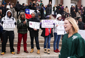 Protesters stand outside Hendricks Chapel as SUNY-ESF graduates file out of Hendricks Chapel. Alicia Garza, the co-creator of #BlackLivesMatter, will be speaking at SU.