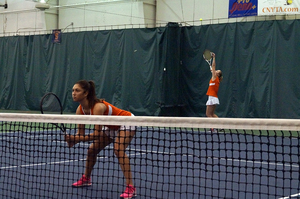 Maria Tritou (left) used to play her matches in Holland alone, without anyone there to watch. Now she plays in front of her team, coaches and fans.