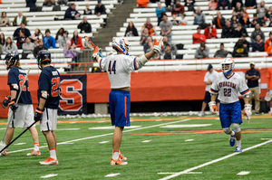 Matt Lane celebrates one of his goals scored against UVA on Sunday, when the 6-foot-6 junior midfielder ended a three-game slide to start the year. 