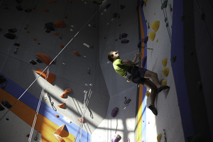 Matthieu Dora, a Rochester Institute of Technology Climbing Team alum, scales a 45 foot wall at Central Rock Gym in Franklin Square.