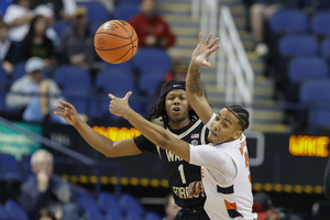 Judah Mintz vies for the ball with Wake Forest's Tyree Appleby. Mintz totaled 18 points in the loss 