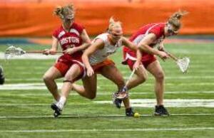 Sarah Sedgwick fights two Boston University players for a ground ball during the Syracuse women's lacrosse team's 17-8 win Wednesday at the Carrier Dome.