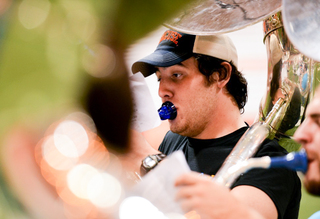 Shaun Kinney, a Syracuse University freshman, practices sousaphone during practice.