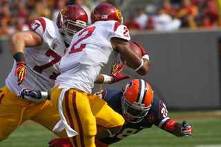 USC Trojans wide receiver Robert Woods #2 tries to avoid Syracuse Orange safety Jeremi Wilkes #28. 