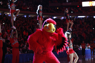 The Louisville Cardinal tries to pump up the small contingent of Louisville fans in Madison Square Garden Saturday night. Syracuse fans filled the arena for the Orange's final Big East tournament game.