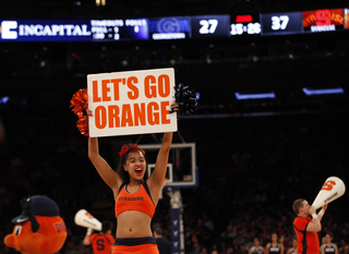 The Syracuse cheer team pumps up the crowd toward toward the end of the second half.