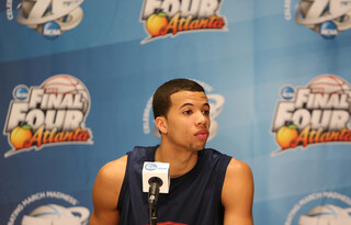 Michael Carter-Williams (1) of the Syracuse Orange looks on during the Final Four interviews of the 2013 NCAA Men's Basketball Tournament at the Georgia Dome.