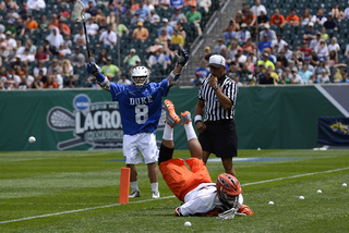 Duke's Josh Dionne celebrates while Brian Megill falls to the ground.