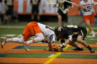 Williams squares up with Black Knights faceoff specialist Alex Daly for a draw.