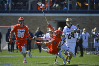 Mike Messina looks to get rid of the ball as the Notre Dame defense comes after him.