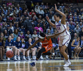 Peterson tries dribbling on Napheesa Collier.