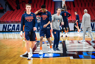 Little Caesars Arena has the March Madness logo at midcourt.