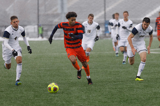 Tajon Buchanan chases after a loose ball.