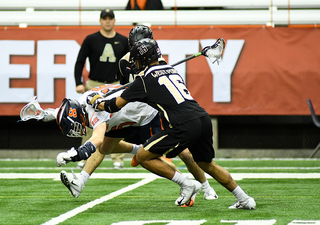 Brendan Curry falls down with the ball. 