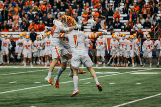 Syracuse celebrates a goal.