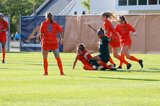 Vlachos is tackled by a Siena player.