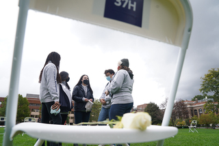 A group of Remembrance Scholars talk with one another before the 