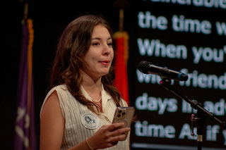 Sasha Temerte, a 2022-23 Remembrance Scholar, recites her original poem, “A One-Time Deal.” Temerte was one of several of the scholars who read or performed original work.